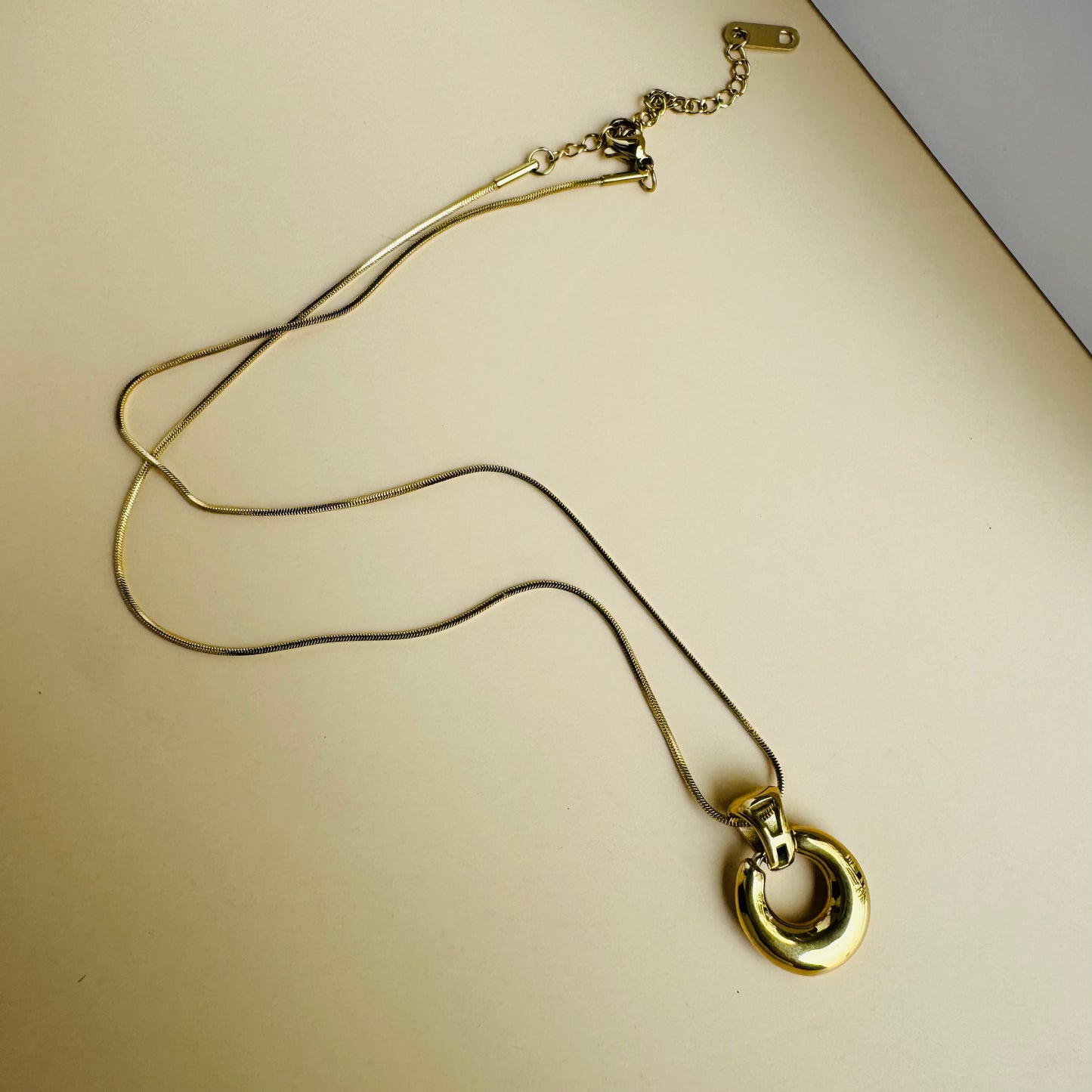 Understated and versatile gold chain necklace on display