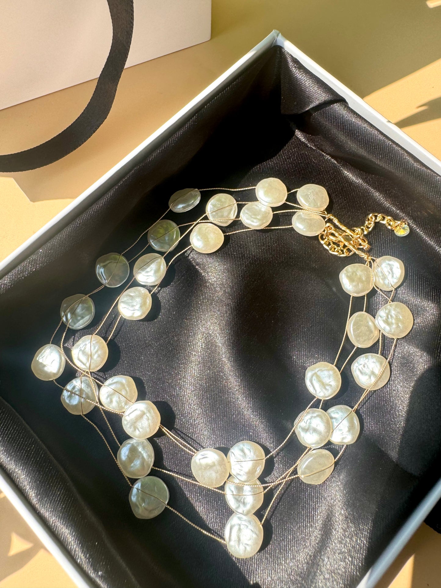 Lush 24 baroque pearl necklace in a gift box.