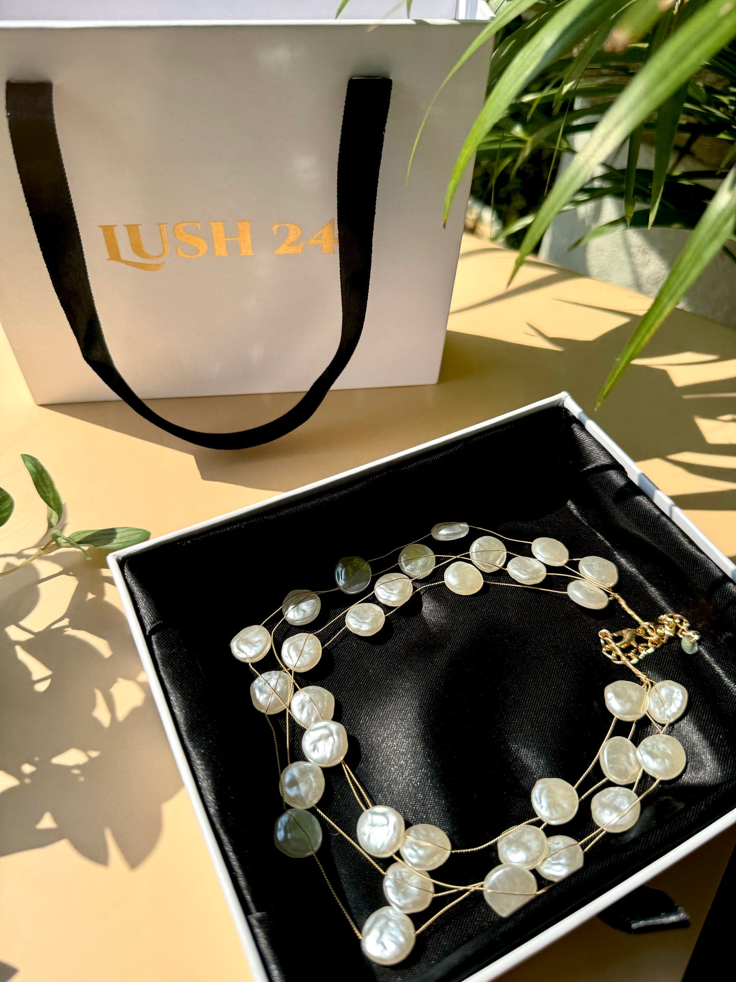 Lush 24 baroque pearl necklace in a gift box.