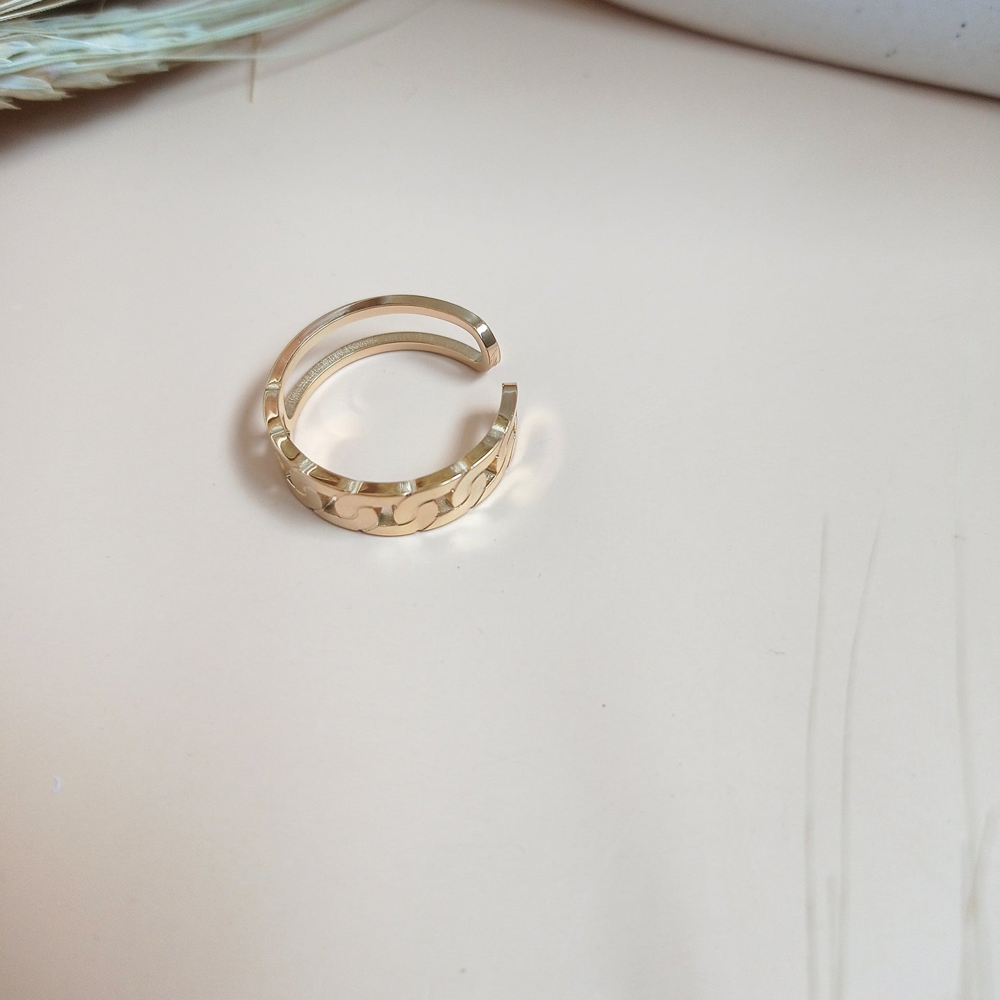 Elegant gold ring with a modern wavy pattern, reflecting luxury and sophistication—perfect for wedding bands, anniversary gifts, or fine jewelry collections