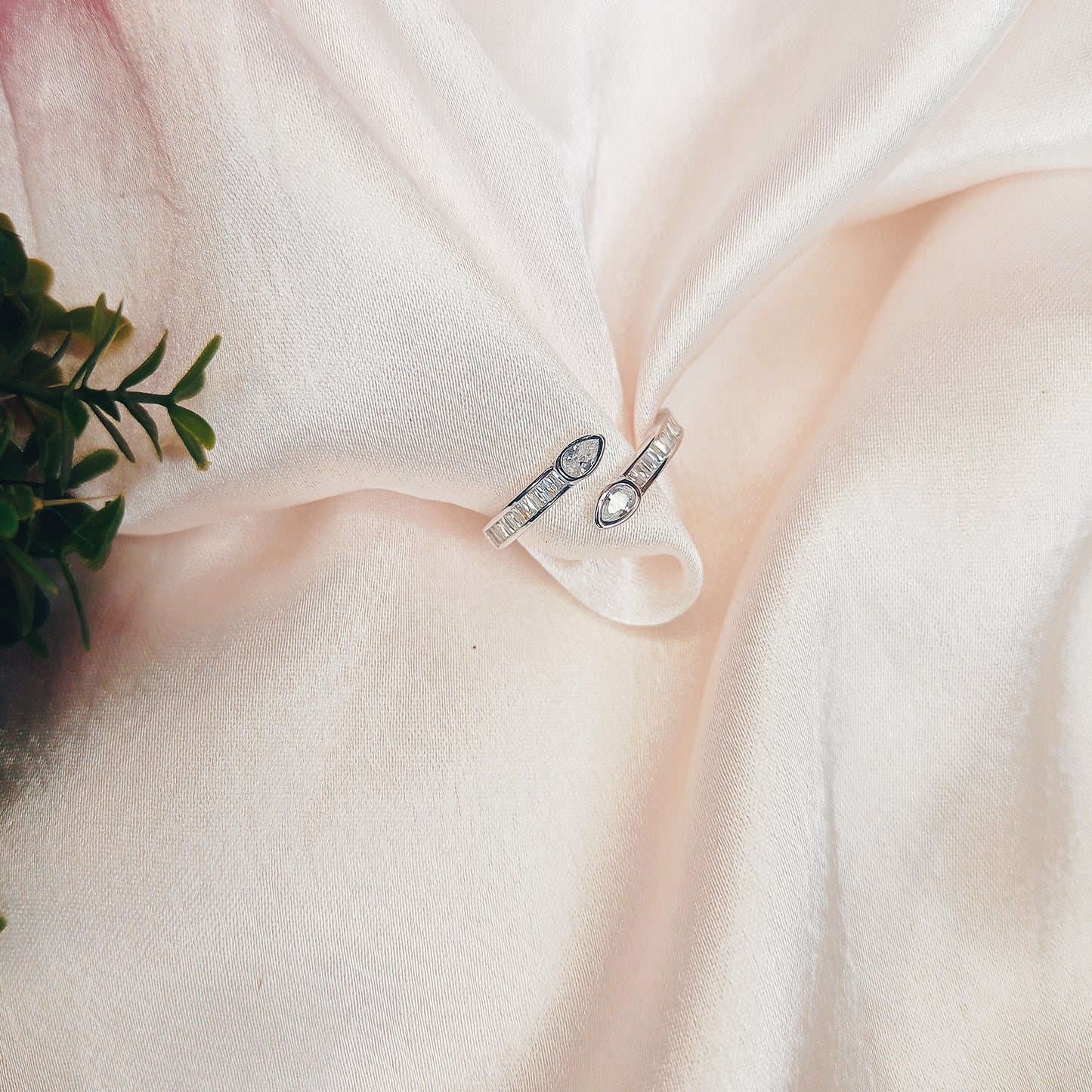 Stylish woman with sleek black hair wearing a delicate diamond ring, a minimalist pendant necklace, and a gold watch, exuding elegance and sophistication—perfect for luxury jewelry promotions and fashion inspiration