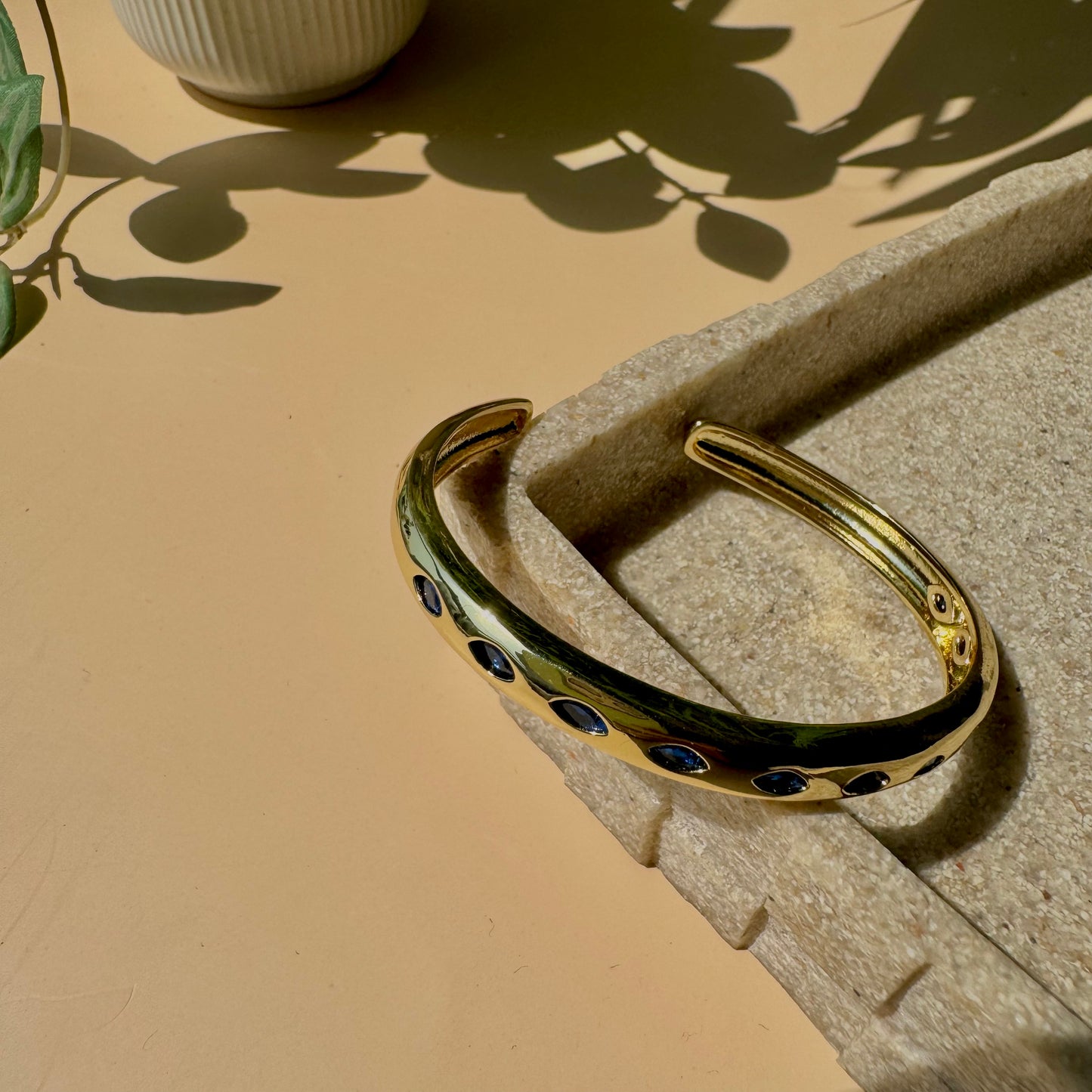 Waterproof gold bracelet on display