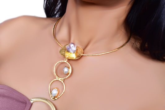 Elegant handcrafted gold choker necklace with statement baroque pearls and textured metal detailing, perfect for luxury and contemporary jewelry lovers