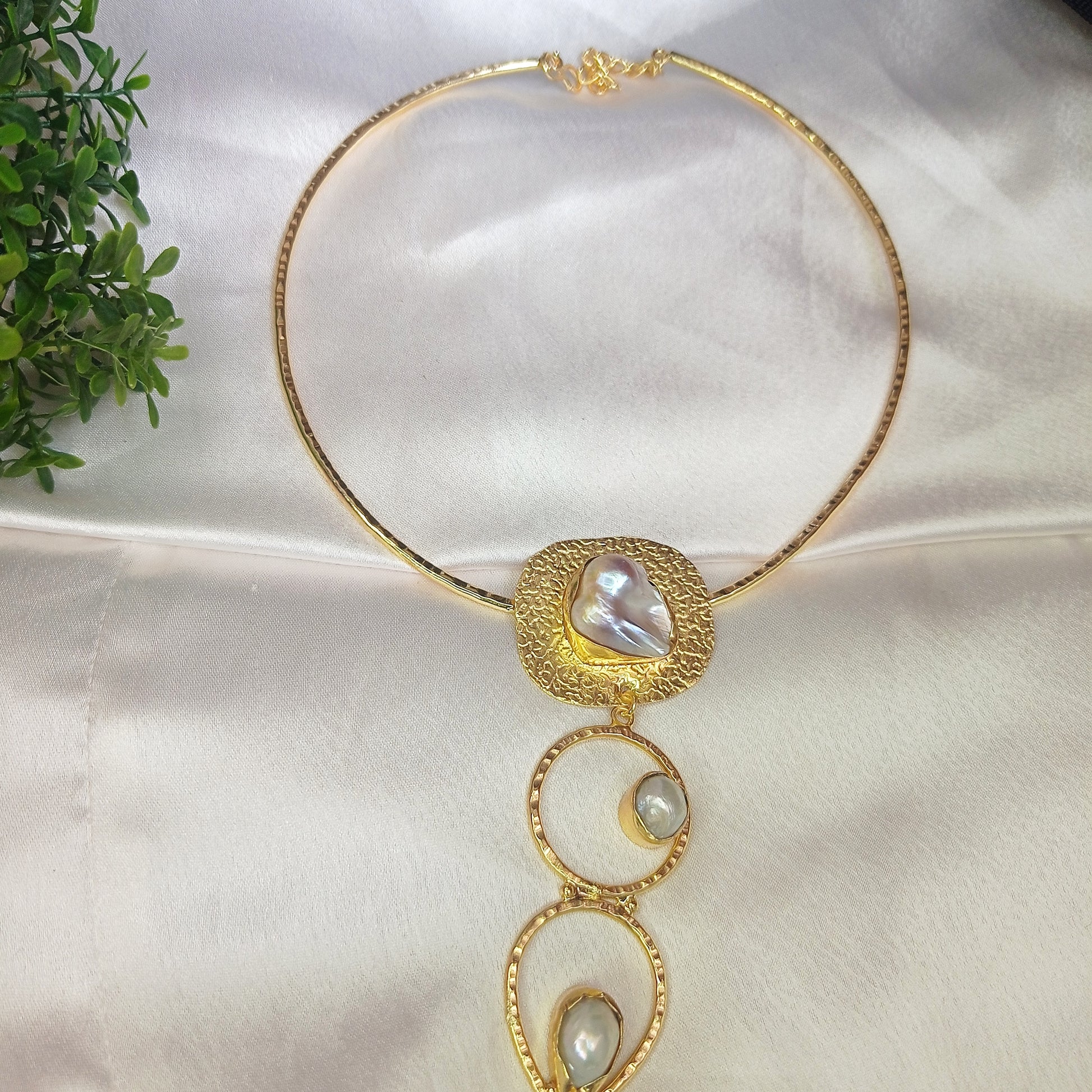 Elegant handcrafted gold choker necklace with statement baroque pearls and textured metal detailing, perfect for luxury and contemporary jewelry lovers
