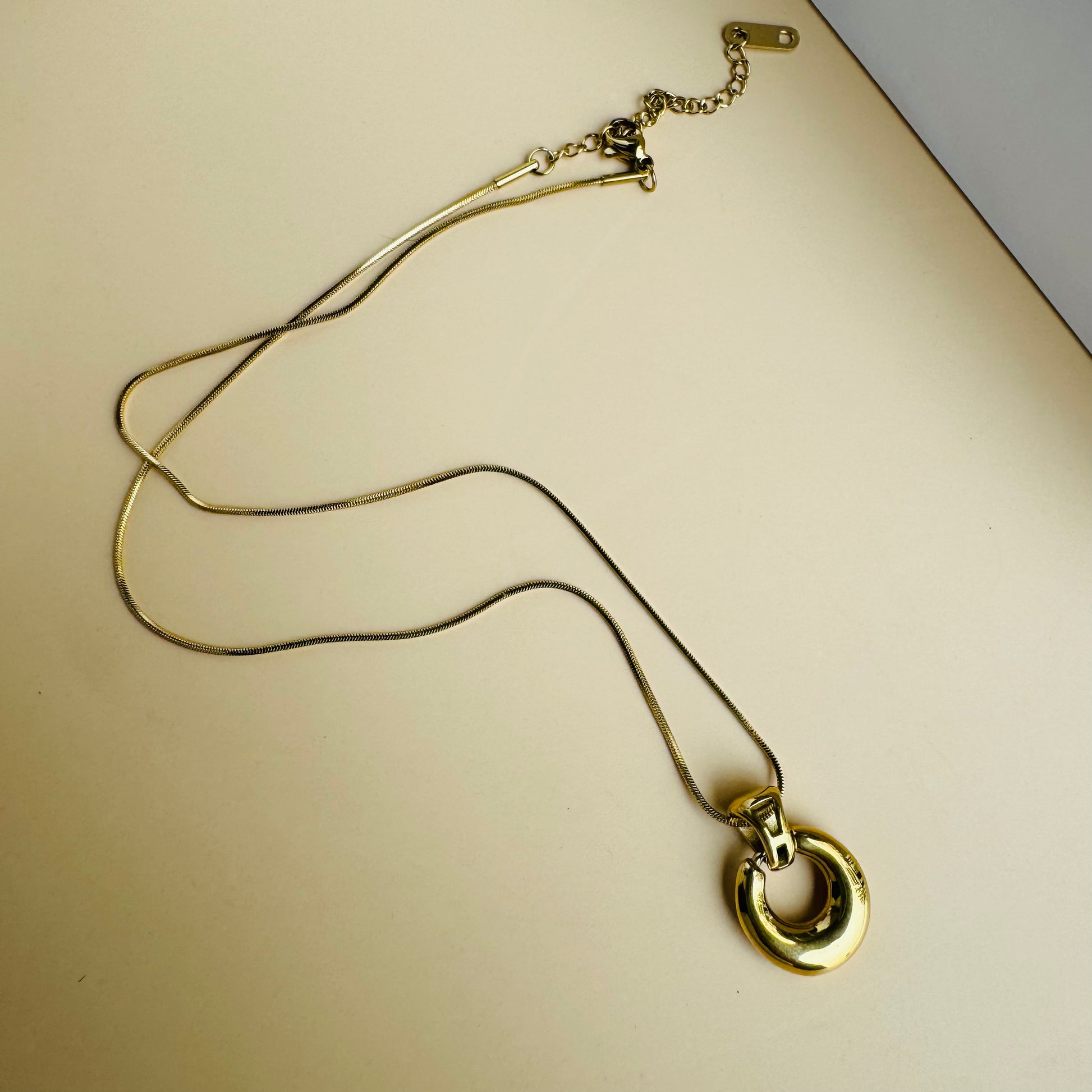 Understated and versatile gold chain necklace on display
