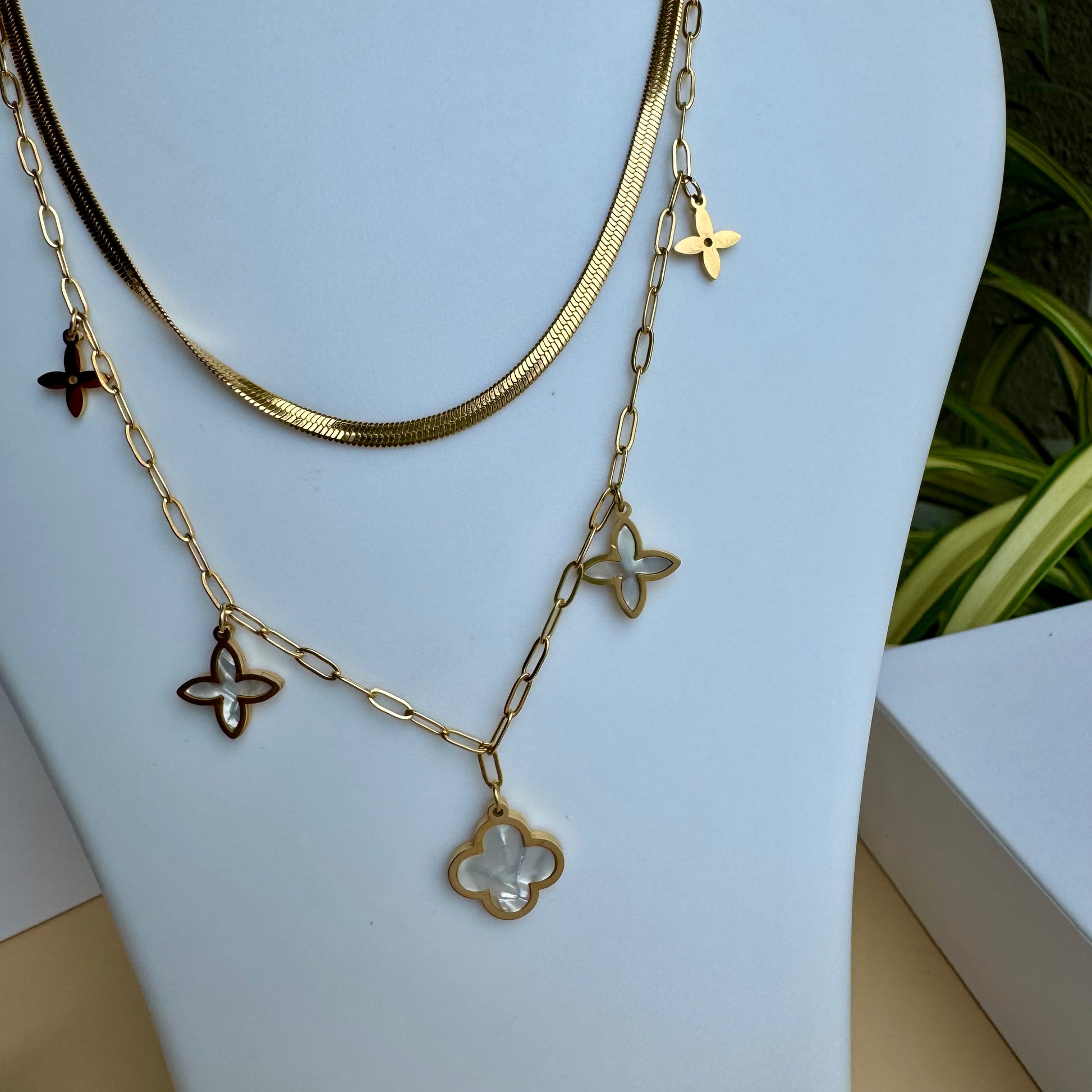 Locally sourced gold chain necklace from "LUSH" displayed on a white bust