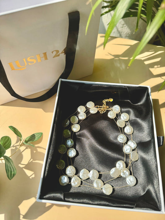 Lush 24 baroque pearl necklace in a gift box.