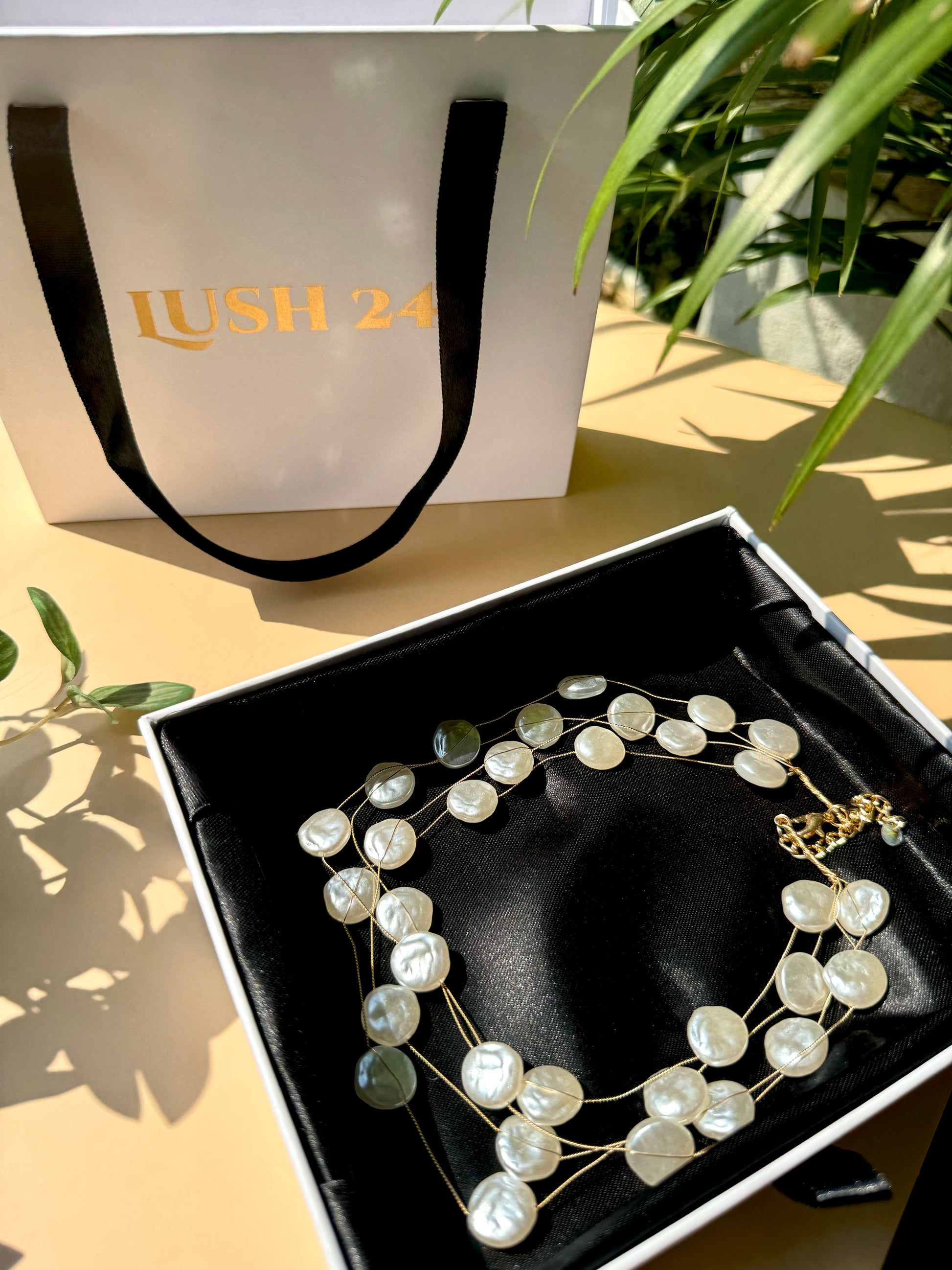 Lush 24 baroque pearl necklace in a gift box.