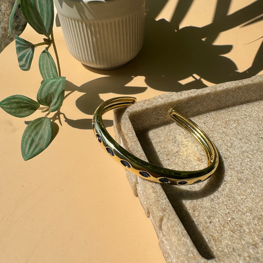 Waterproof gold bracelet on display