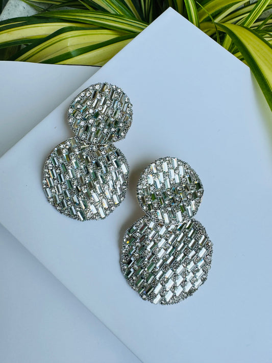 Two pairs of sparkling silver earrings with crystal embellishments
