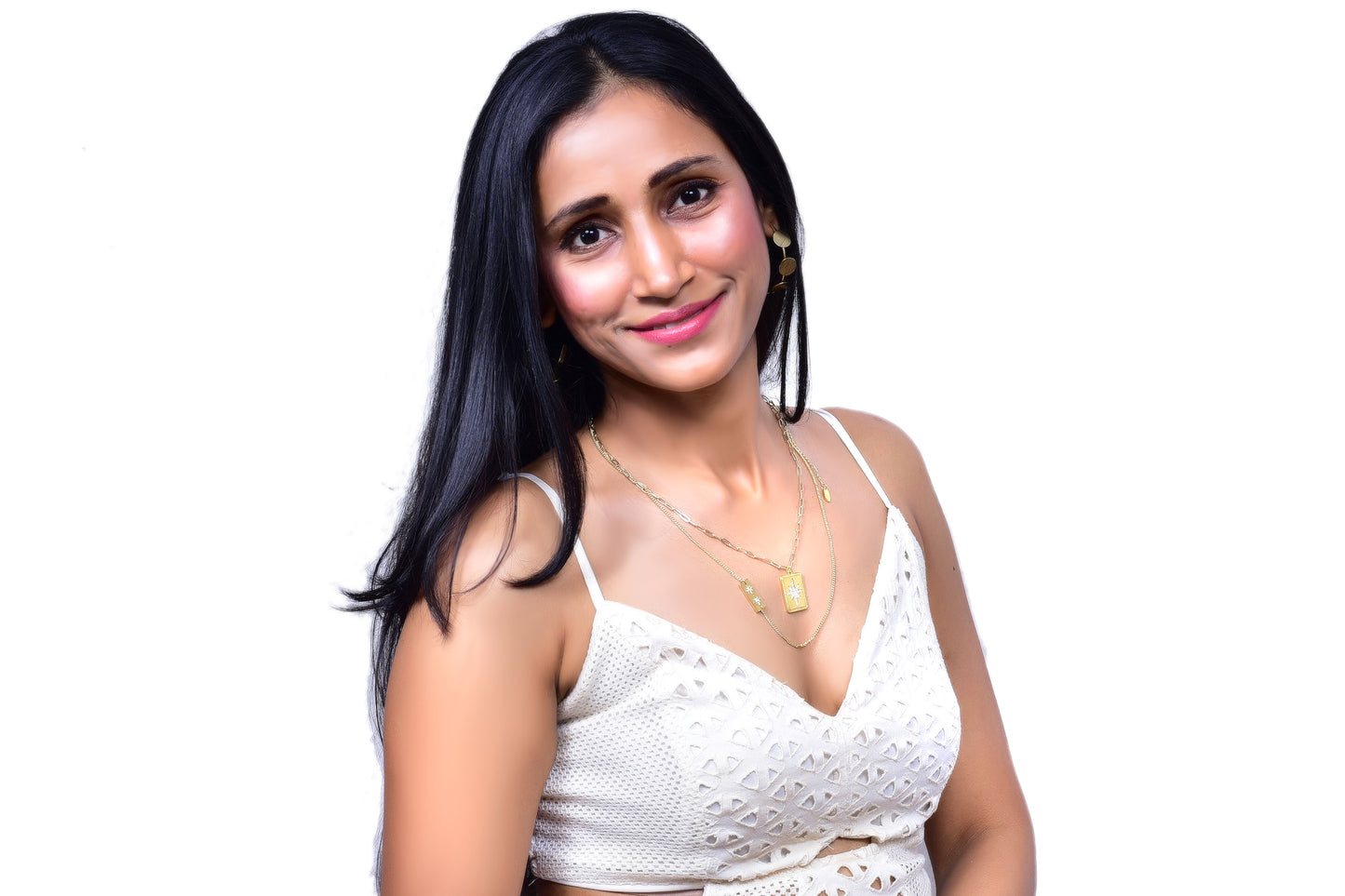 Trendy layered gold necklace with rectangular pendant charms featuring intricate designs, perfect for boho-chic and statement jewelry lovers