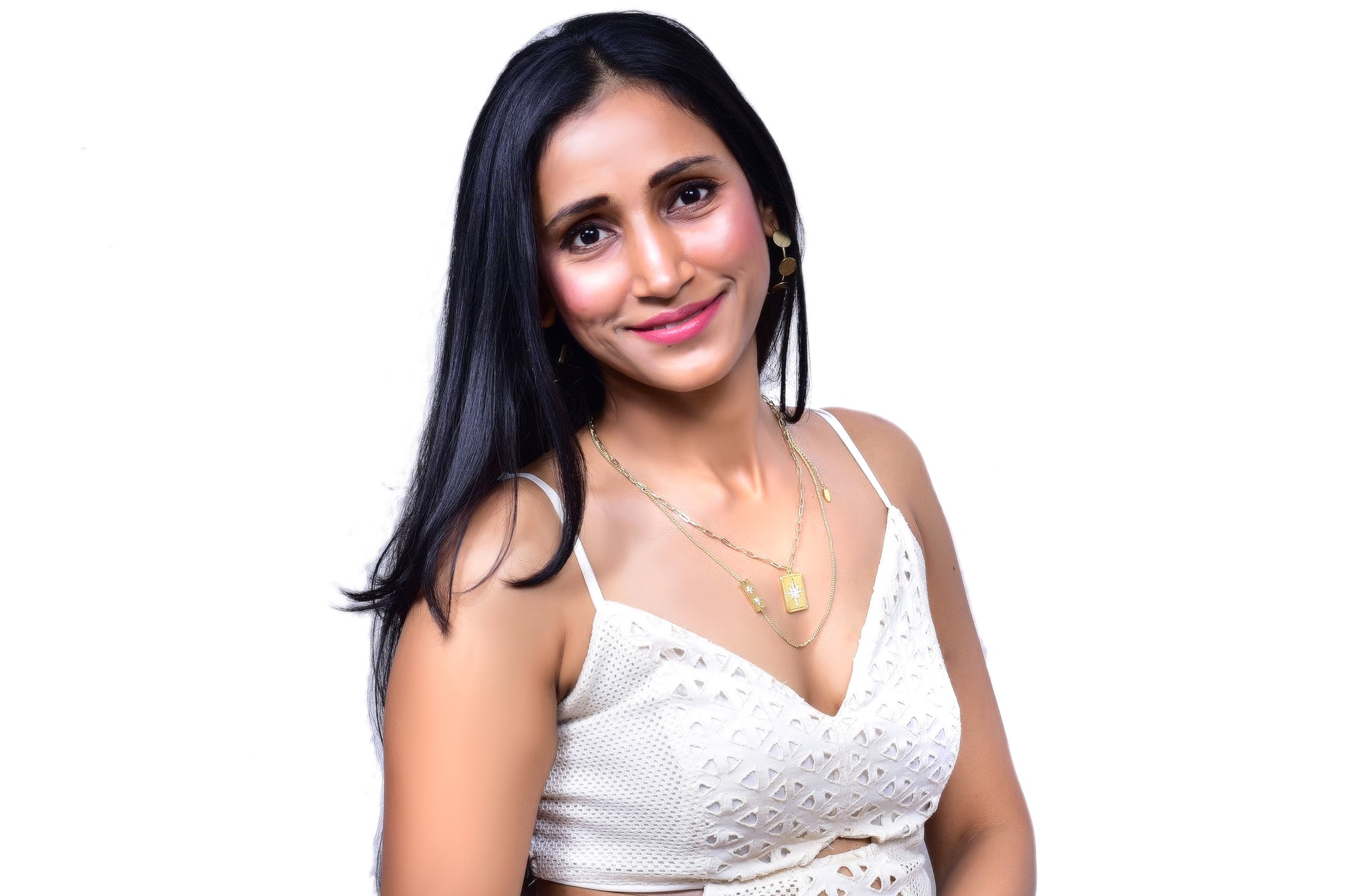 Trendy layered gold necklace with rectangular pendant charms featuring intricate designs, perfect for boho-chic and statement jewelry lovers