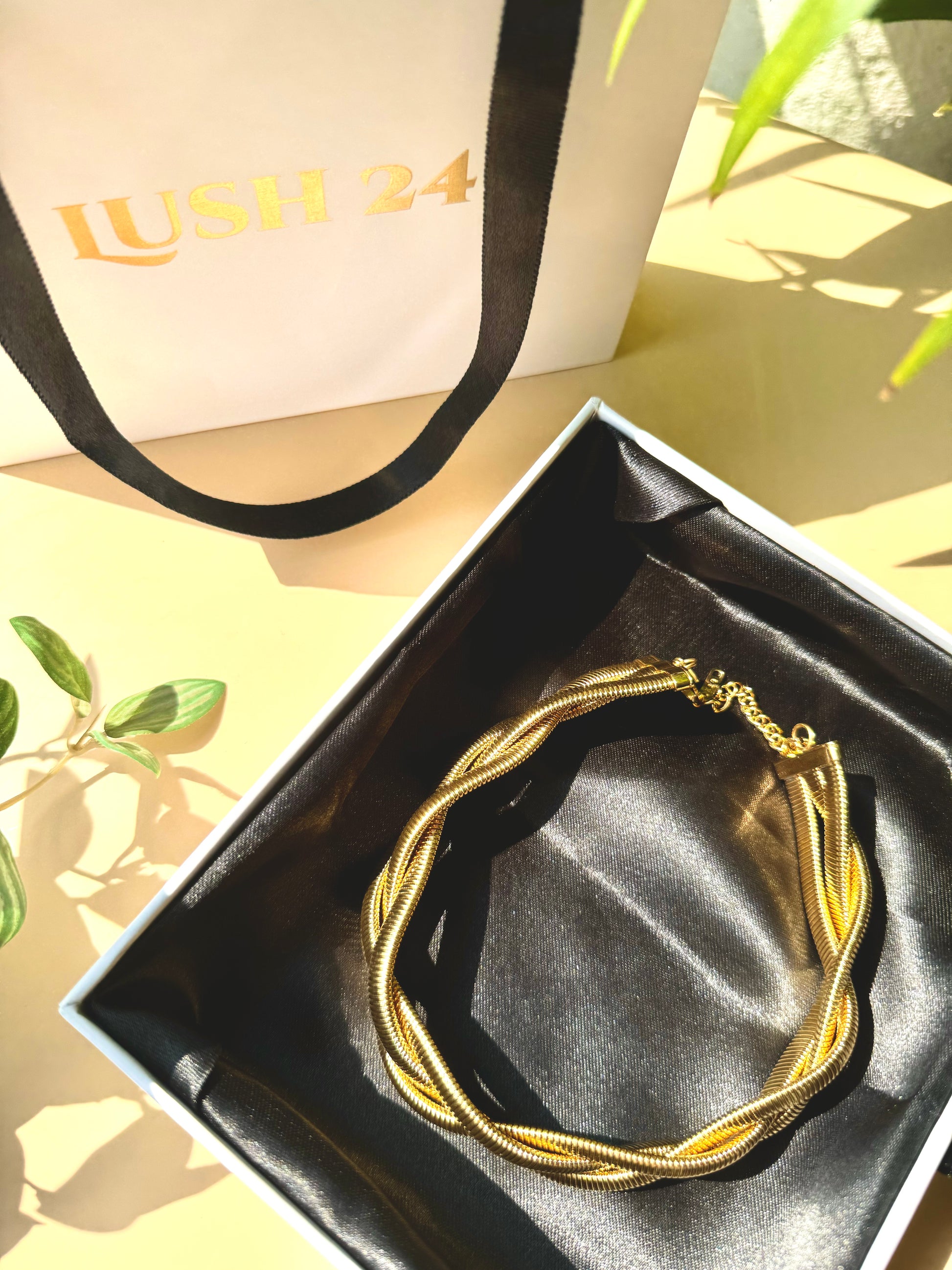Elegant and locally sourced (Mumbai, Maharashtra, India) triple braided snale necklace by Lush 24. The necklace features a multi-strand design with irregular, luminous design and is packaged in a sophisticated gift box with the brand's logo