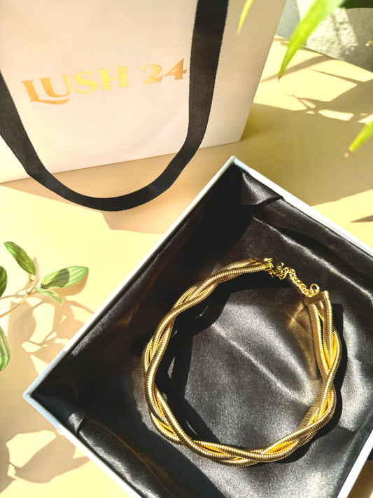 Elegant and locally sourced (Mumbai, Maharashtra, India) triple braided snale necklace by Lush 24. The necklace features a multi-strand design with irregular, luminous design and is packaged in a sophisticated gift box with the brand's logo