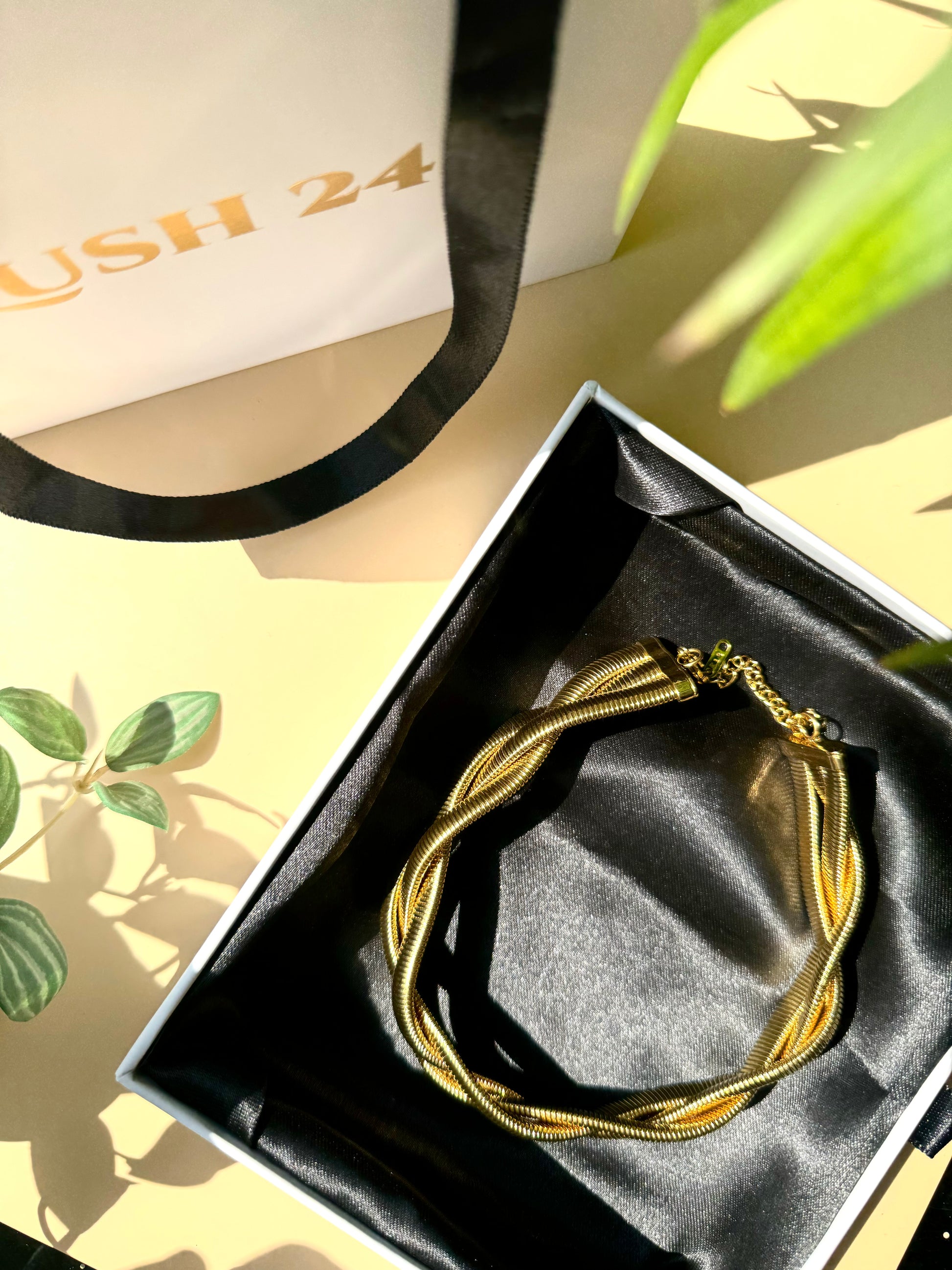 Elegant and locally sourced (Mumbai, Maharashtra, India) triple braided snale necklace by Lush 24. The necklace features a multi-strand design with irregular, luminous design and is packaged in a sophisticated gift box with the brand's logo