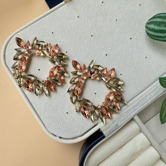 A pair of sophisticated 18K vintage sherman crystal earrings with a dangling, presented in a stylish jewelry case. These earrings are likely available in Mumbai, Maharashtra, India